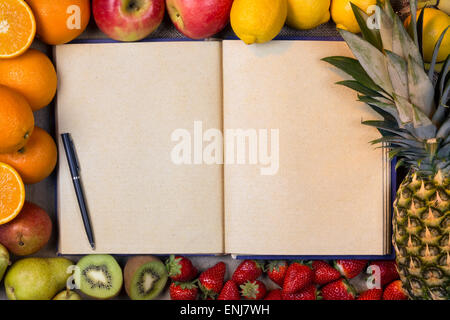 Selection of Fresh Fruit with an Open Recipe Book - Blank Pages - Space for Text Stock Photo