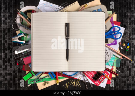 Selection of stationery for the office or for going back to school or college - Open book with space for text. Stock Photo