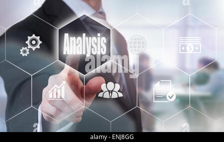 Businessman pressing an Analysis concept button. Stock Photo