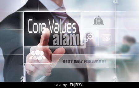 Businessman pressing a Core Values concept button. Stock Photo