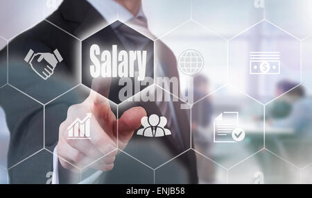 Businessman pressing an Salary concept button. Stock Photo