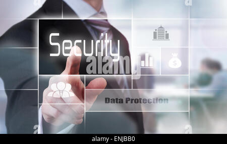 Businessman pressing a security concept button. Stock Photo