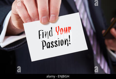 A businessman holding a business card with the words, Find your Passion! Stock Photo