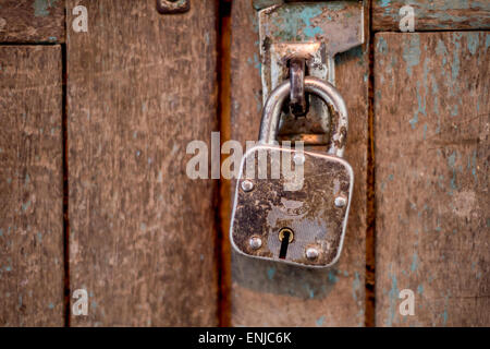 Retro Padlock on Wooden door Stock Photo