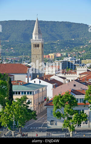 Town of Koper in Slovenia with bell tower of Cathedral of St Mary's Assumption rising above Tito square in urban landscape on Istrian Peninsula Stock Photo