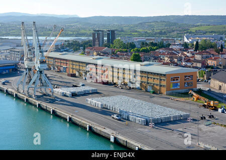 Port of Koper cranes warehouses & large consignment of aluminium ingots on quayside Slovenia Istrian Peninsula Adriatic Sea Europe Stock Photo