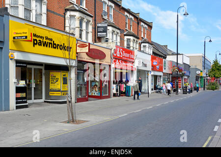 Money shop pawnbroker store & other small shop units in East Ham pedestrianised high street (except for buses) Newham East London England UK Stock Photo