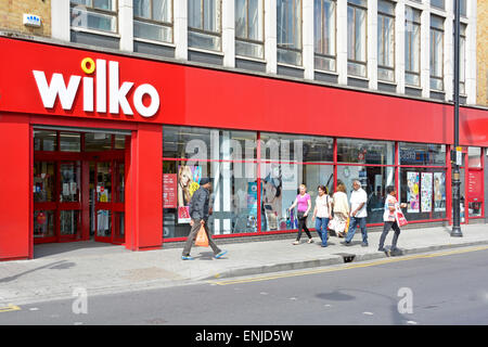 East Ham shopping high street & pavement Wilko store sign & shop front window re-branded from Wilkinson Hardware Stores Newham East London England UK Stock Photo