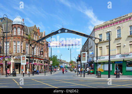 Major road box junction in East Ham with main shopping street High Street North with arch restricted entry to vehicles Newham East London UK Stock Photo