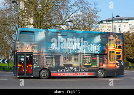 Golden Tours shuttle bus running passenger route enthusiasts from Victoria to Warner Bros ‘Harry Potter Studio Tour’ experience at Watford England UK Stock Photo