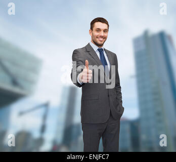 handsome buisnessman showing thumbs up Stock Photo