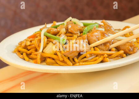 Authentic Chinese chicken lo mein noodles at a restaurant Stock Photo