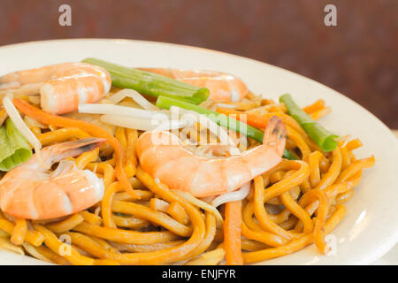 Authentic Chinese Shrimp lo mein noodles at a restaurant Stock Photo