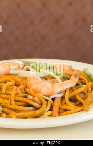 Authentic Chinese Shrimp lo mein noodles at a restaurant Stock Photo