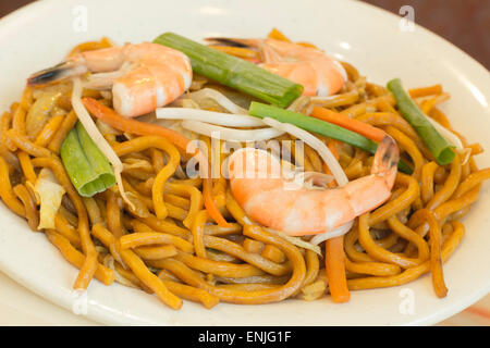 Authentic Chinese Shrimp lo mein noodles at a restaurant Stock Photo