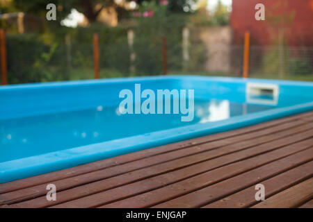 residence with swimming pool and deck. Surrounded by fence Stock Photo