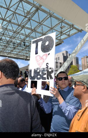 Toronto, Canada. 6th May, 2015. Nathan Phillips Square was the scene for the gathering of 100+ Uber supporters, organized in a semi-circle, chanting “Make Uber here to stay! Don’t let it go away!” and other various pro-Uber statements. Credit:  NISARGMEDIA/Alamy Live News Stock Photo