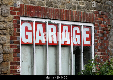 Old fashioned car garage sign in Petworth, West Sussex, UK. Stock Photo