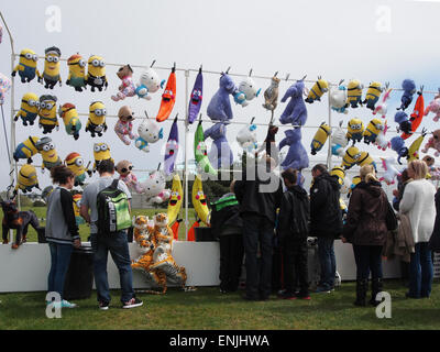 A tombola ticket stall at a fairground with cuddly toy prizes Stock Photo