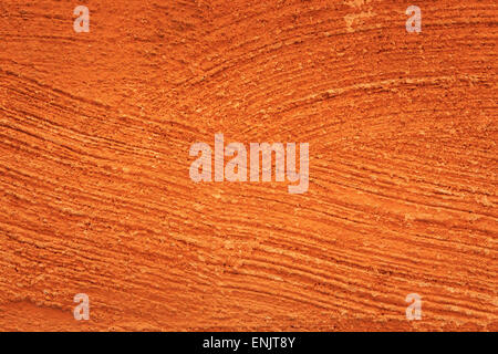 Macro Close-up of structure and details of orange colorful plaster wall Stock Photo