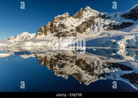 Reflections in the calm waters of the Lemaire Channel, Antarctica, Polar Regions Stock Photo