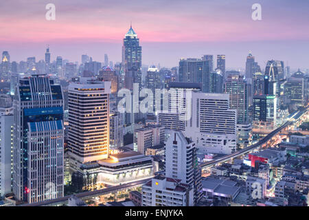 City skyline looking along the BTS Skytrain, Sukhumvit Road and Phloen Chit to Phloen Chit station, Bangkok, Thailand Stock Photo