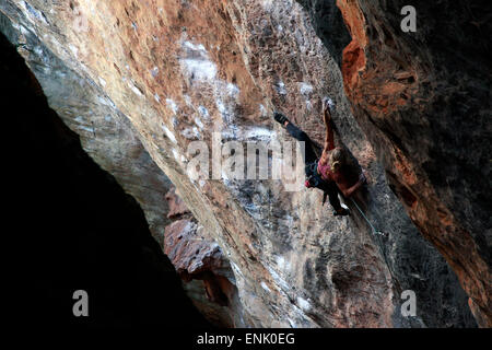 A climber scaling limestone cliffs in the jungle at Serra do Cipo, Minas Gerais, Brazil, South America Stock Photo