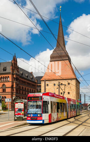 Tram stop at the Stone Gate in Steinstrasse, 'Stone Street', south of Neuer Markt, Rostock Germany. Higher Regional Court, left. Stock Photo