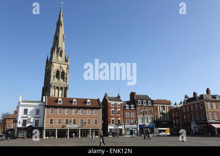 The spire of St. Mary Magdalene church rises over building on the Market Square in Newark-upon-Trent, Nottinghamshire, England Stock Photo