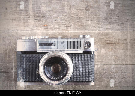 An old and vintage camera on a wooden floor Stock Photo