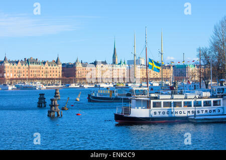 Sweden, Stockholm - Ferry Boats moored in winter and Strandvagen Stock Photo