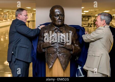 British Chief of the Defence Staff Gen. Nick Houghton and U.S. Deputy Secretary of Defense Bob Work unveil a bust of Sir Winston Churchill during a ceremony at the Pentagon May 5, 2015 in Arlington, Virginia. The bust was a gift from the United Kingdom for the Hall of Hero museum in the Pentagon. Stock Photo