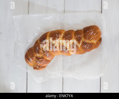 Braided Bread on white wood and baking paper. Stock Photo