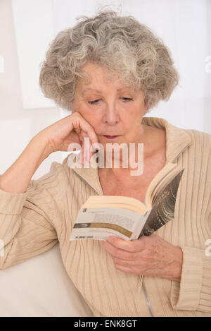 Elderly person reading Stock Photo