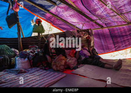 Kobani, Kobani, Nepal. 5th May, 2015. Tents camp housing homeless villagers as they have to sleep here since the powerful earthquake on the Araniko Road near the Kobani Village (Tibetan Border).Isolated Nepalese Villagers still waiting for help and worry about an other earthquake happen.Most of the houses from ''Dolalgat'' to ''Kobani'' (around 65km) collapsed, destroyed by huge stones fell from the mountains, (and stones are still falling as now), around 5 or 6 earthquakes are felt every day and night, and people didn't get any help from anyone, the phone network doesn't work, they got enou Stock Photo