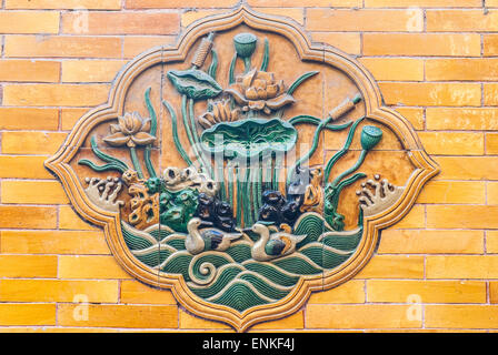 Traditional glazed tile picture wall in Forbidden City Stock Photo