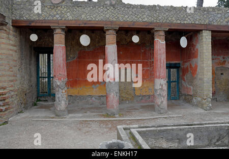 House of Relief of Telephus with columns and hanging oscilla, Herculaneum, Ercolano, Italy. Stock Photo