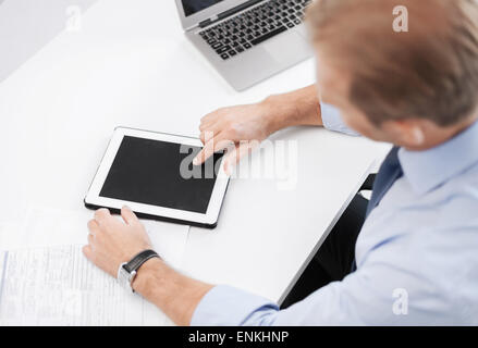 businessman with tablet pc in office Stock Photo