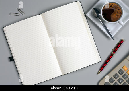 Take a memo - Notepad and coffee cup on an office worktop - Space for Text Stock Photo