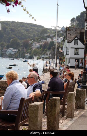 People sat on benches and enjoying the view in Bayard's Cove, Dartmouth. Stock Photo