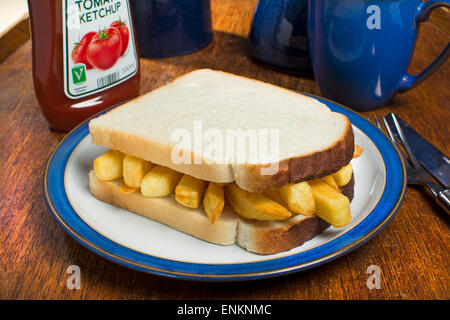A potato chips sandwich, commonly known as a chip butty in the UK Stock Photo