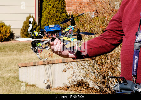 A 50 year old Caucasian man holds his DYI built quad copter. USA Stock Photo