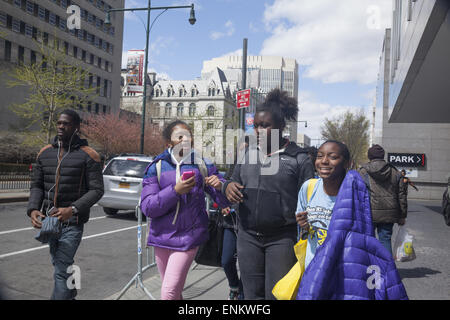 African American teens walking on the street after school in downtown Brooklyn, NY. Stock Photo