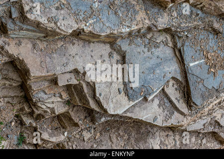 Rock formation. Geology. Layers of gray stones and dirt discovering interesting shapes. Stock Photo