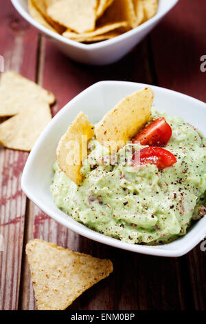 Homemade guacamole with tortilla chips Stock Photo