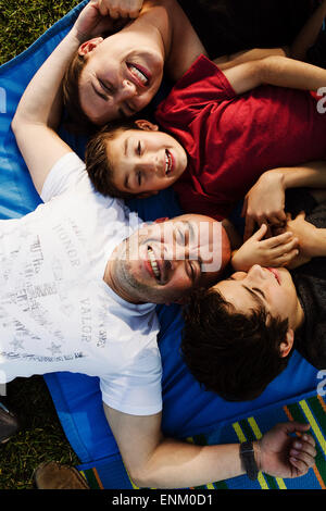 A hispanic family enjoys time together at a park in San Diego, Ca. Stock Photo