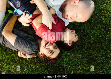 A hispanic family enjoys time together at a park in San Diego, Ca. Stock Photo