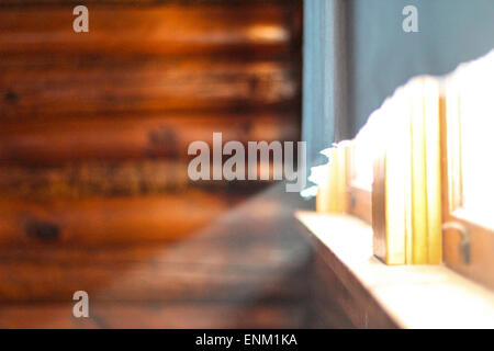 Morning light shines through a window in a cabin Stock Photo