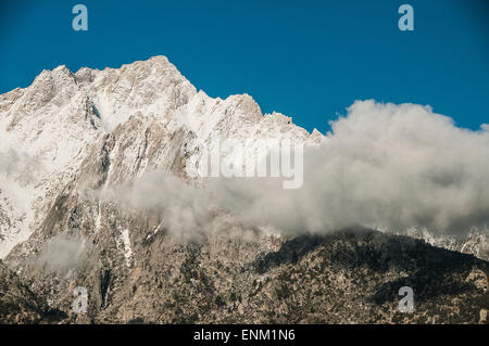 Early morning clouds move across the face of Mount Whitney, eastern Sierras, California. Stock Photo