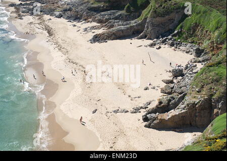 enticing beach with white sand and blue water Stock Photo